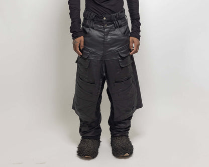 Person wearing black silhouette skirt made of organic cotton, hand-made, and designed in Paris, standing against a neutral background