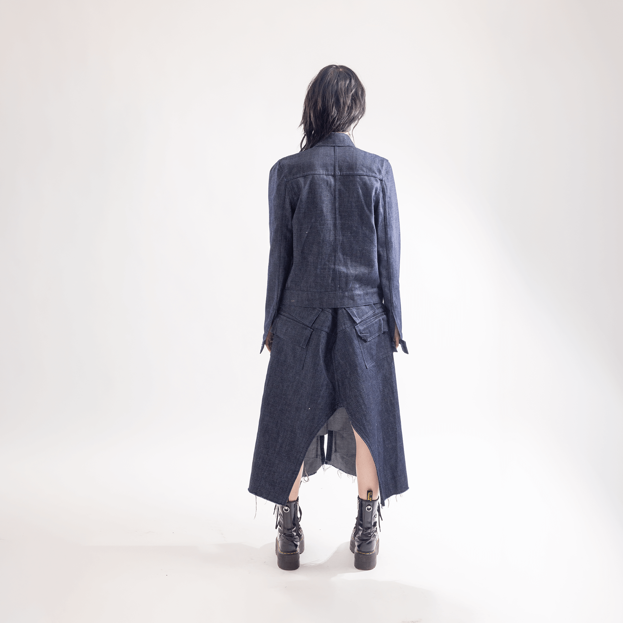 Woman wearing a handmade silhouette skirt made from organic cotton, designed in Paris, showcasing the back view.