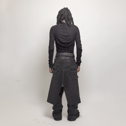 Back view of model in black plissé top from GOES WRONG "SILHOUETTE" collection, featuring handmade design in organic cotton, designed in Paris.